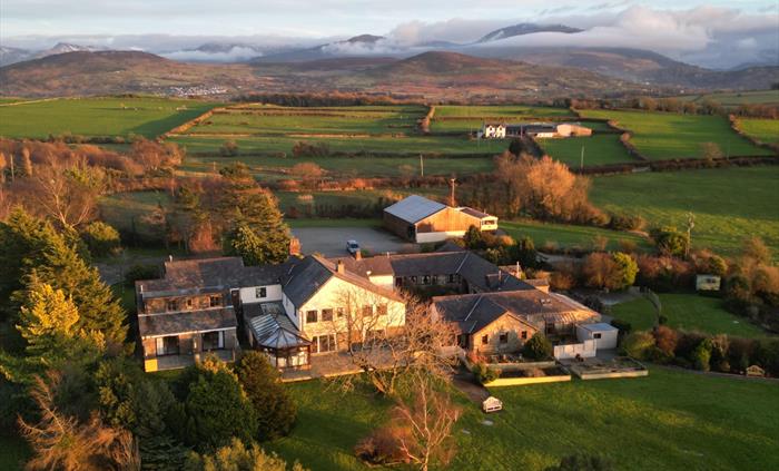 Aerial view of the grounds and exterior of Ty'n Rhos country house